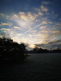 Scenic view of silhouette trees against sky during sunset