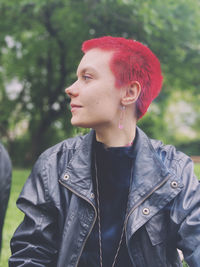 Portrait of teenage girl looking away outdoors