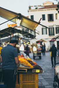 Man selling food on city street