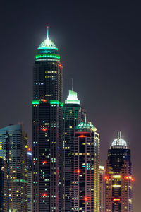 Illuminated buildings in city at night