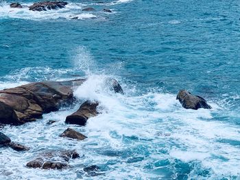 Waves splashing on rocks