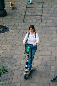 High angle view of women standing on footpath