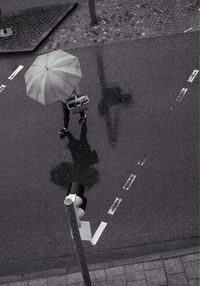 High angle view of pedestrian crossing road