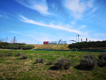 Scenic view of field against blue sky