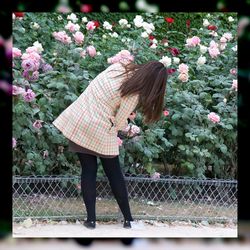 Woman holding pink flower