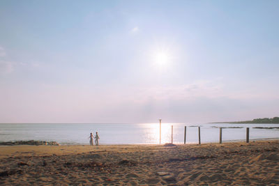 Scenic view of beach against sky during sunset