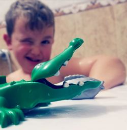 Close-up of boy playing with toy