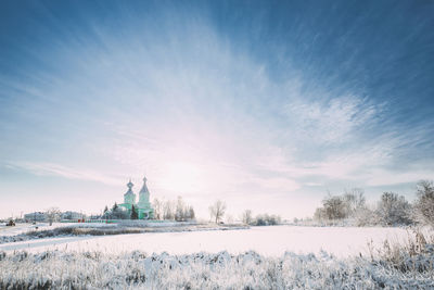 Scenic view of snow covered landscape against sky