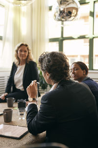 Business colleagues working at table