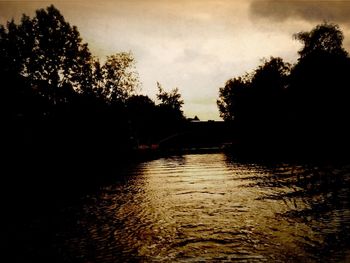 Scenic view of river at sunset