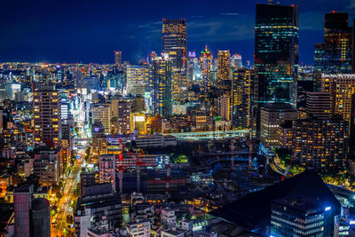 Illuminated buildings in city at night