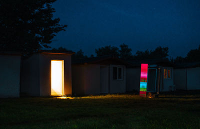 Refrigerator in the backyard at night