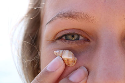 Close-up portrait of girl holding hands