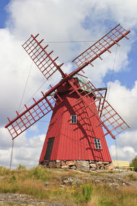 Red windmill on a hill