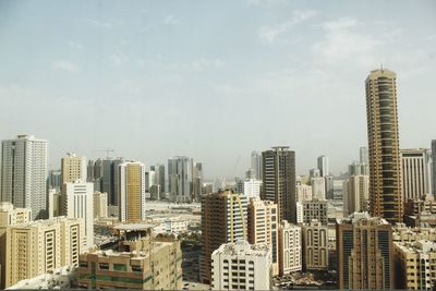 Modern buildings in city against sky