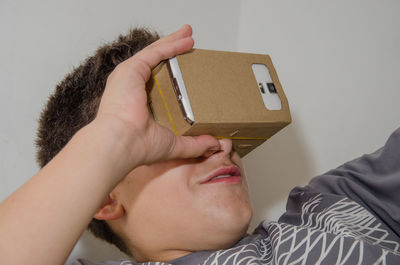 Close-up of boy wearing virtual reality simulator