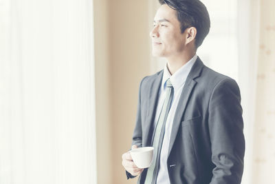 Young man and coffee cup