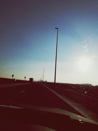 Empty road along countryside landscape