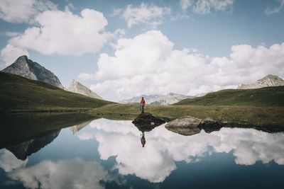 Scenic view of lake against cloudy sky
