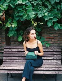 Young woman sitting outdoors