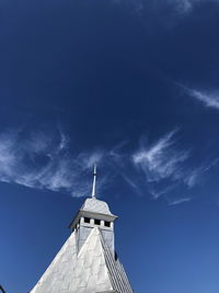 Low angle view of building against blue sky