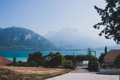 Scenic view of sea and buildings against sky