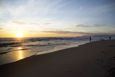 Scenic view of sea at sunset