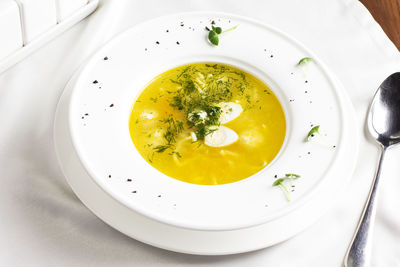 High angle view of soup served in plate on table