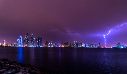 View of illuminated dubai city at night in storm