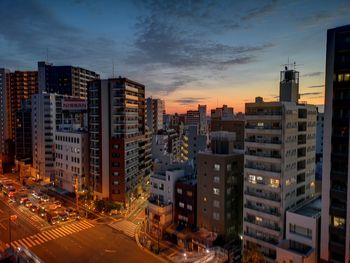 High angle view of buildings in city against sky during sunset