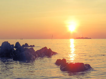 Scenic view of sea against sky during sunset