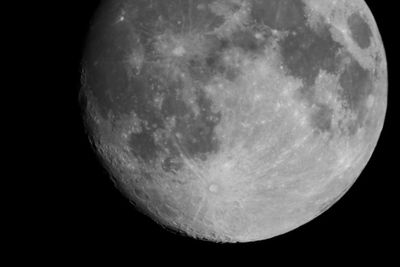 Low angle view of half moon against sky at night