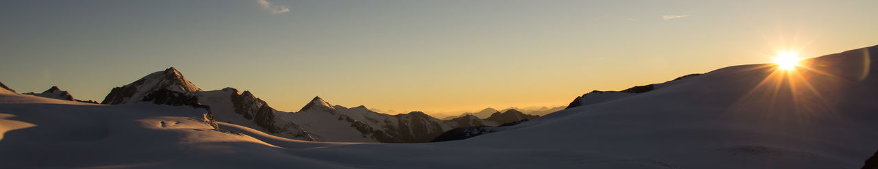 Scenic view of mountains against sky during sunset