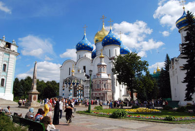 Group of people in front of building against sky