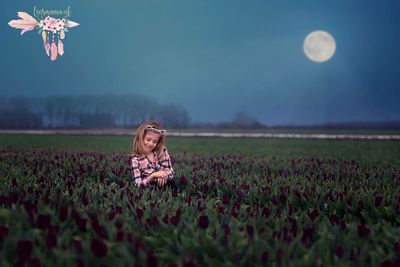 Full length of woman standing on field against sky