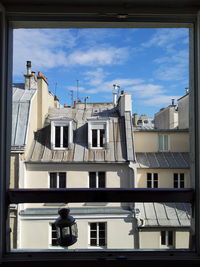 Buildings seen through window 