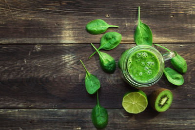 High angle view of fruits and leaves on table