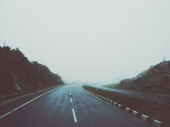 Road amidst landscape against clear sky