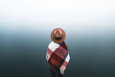 Close-up of hat against blue background