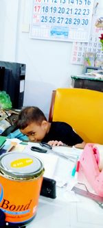 Portrait of cute boy on table