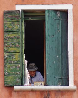 Senior man listening radio on