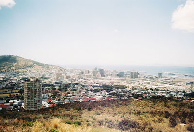High angle view of buildings in city against sky