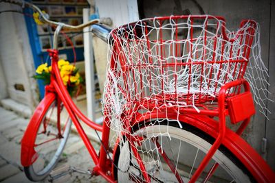 Close-up of red bicycle in basket