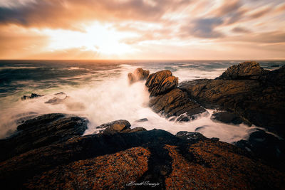 Scenic view of sea against sky during sunset