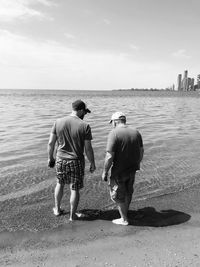 Rear view of people on beach