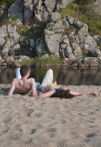 Couple lying on beach 