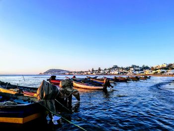 Fishing boats in marina at harbor