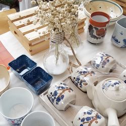 High angle view of ceramic tea set on table