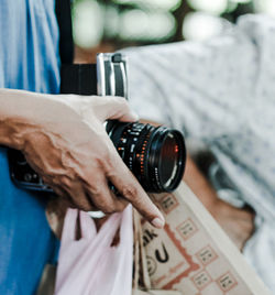 Close-up of man photographing