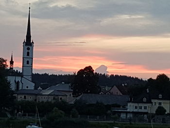 Temple against sky at sunset